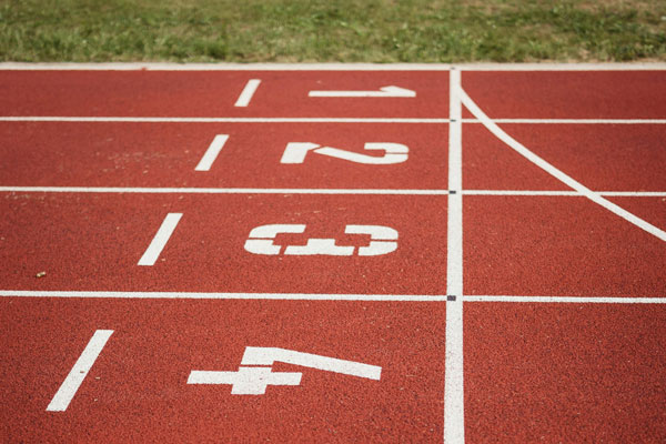 An image of a running track with numbers on it to represent how you could get ahead of the competition by installing solar