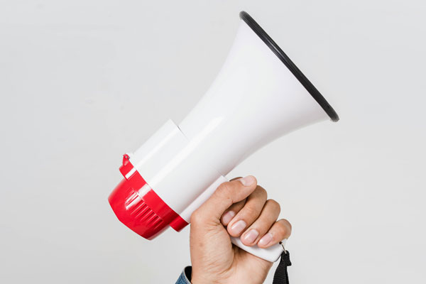 An image of a microphone to represent sharing the news that you are installing solar energy
